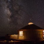 The Milky Way is shown in the sky above a yurt at Dead Horse Point State Park near Moab, Utah. Photo credit: Bret Edge.