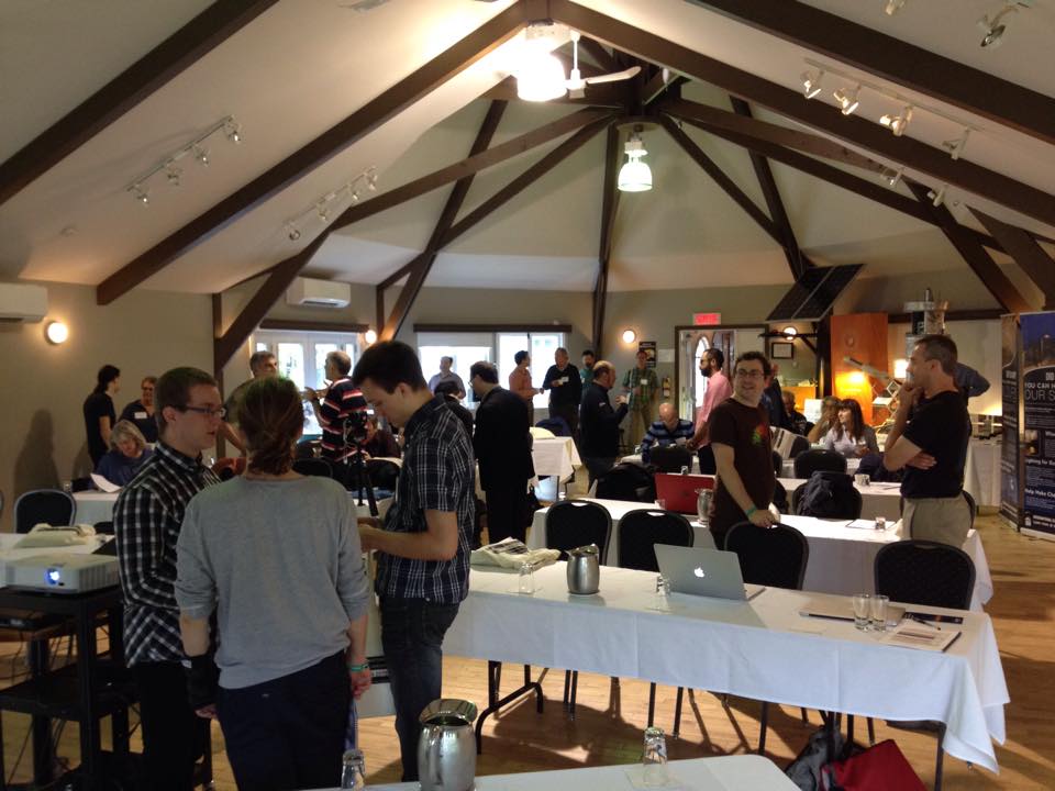 Conference Attendees Gather and Talk Before the Meeting Starts