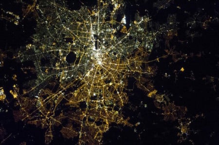 A satellite image of Berlin at night showing the differnce between the lights of west and east Berlin.