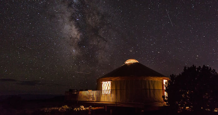 The Milky Way is shown in the sky above a yurt at Dead Horse Point State Park near Moab, Utah. Photo credit: Bret Edge.