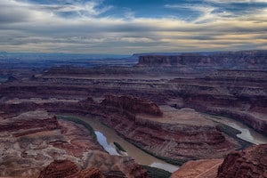 Stunning views of Canyonlands National Park and an iconic gooseneck bend in the Colorado River.