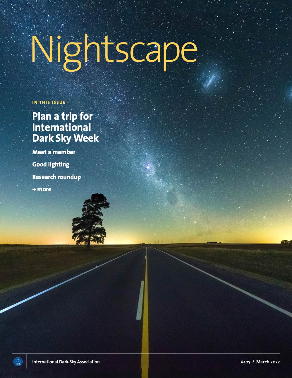 Cover of Nightscape magazine #107 showing a road narrowing off into the distance, with a starry night sky above the horizon