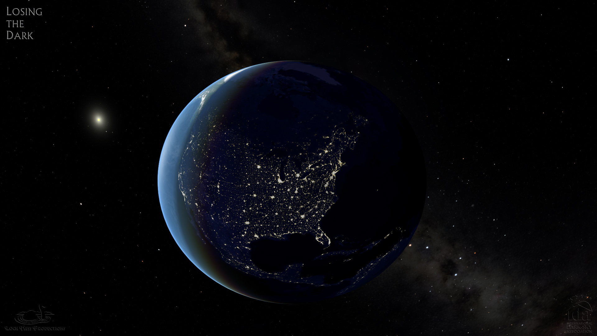 The Earth from space, looking at the night side and seeing yellow lights burning brightly where there are cities on North America.