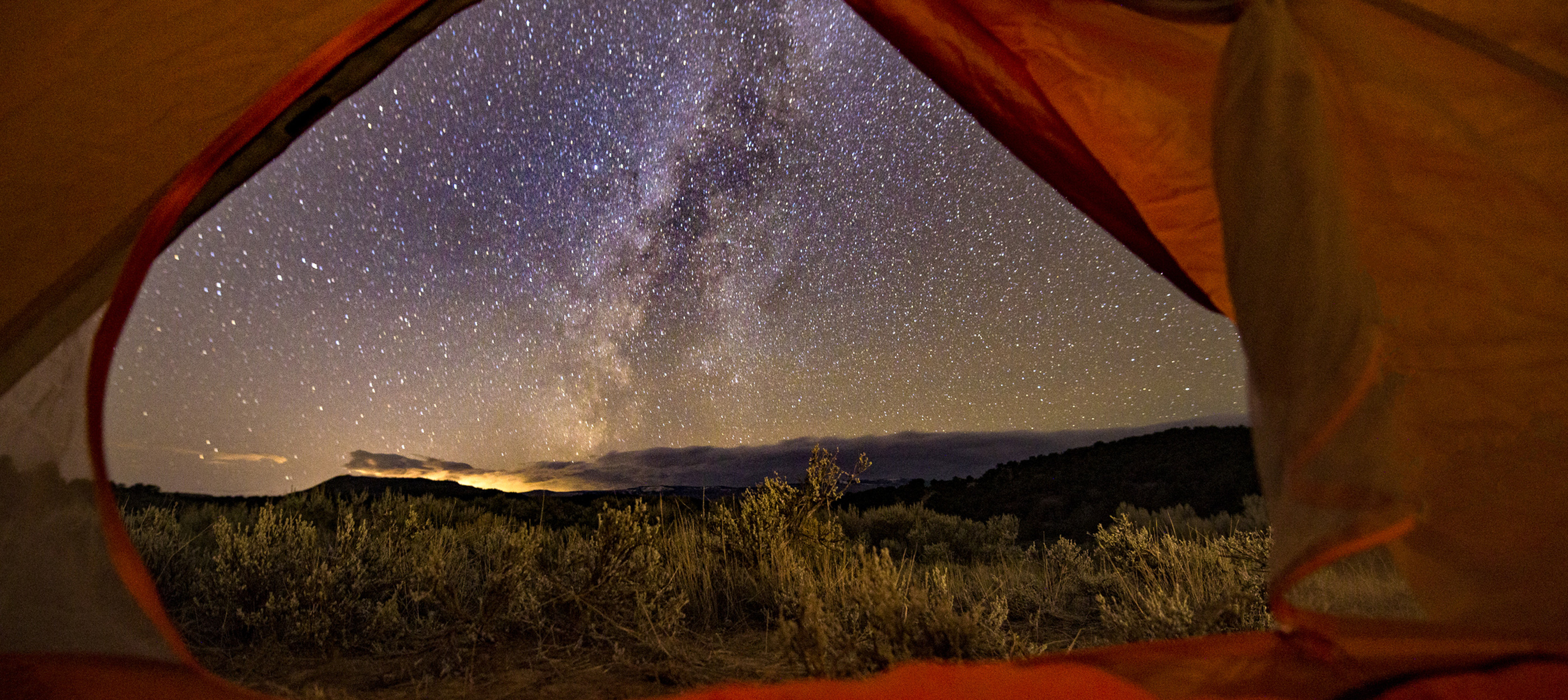 View of the Milky Way from inside of a camping tent.