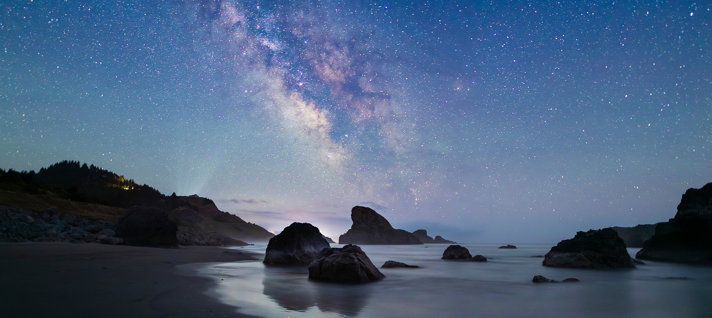 Milky Way over beach scene.
