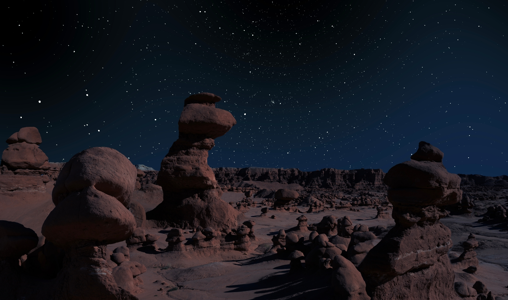 Sandstone formations in Utah's Goblin Valley State Park against a dark sky
